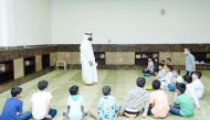 Children attend a session as part of Awqaf Ministry's summer programme. 