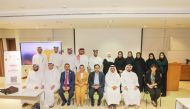 QRCS Secretary-General, Faisal Mohamed Al Emadi (second right, front) and other officials at the workshop.