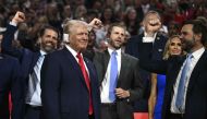 US former President and 2024 Republican presidential candidate Donald Trump (bottom L) smiles as he is cheered on during the first day of the 2024 Republican National Convention at the Fiserv Forum in Milwaukee, Wisconsin, July 15, 2024. (Photo by Brendan Smialowski / AFP)