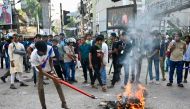 Anti-quota protesters and students backing the ruling Awami League party clash in Dhaka on July 16, 2024. (Photo by Munir Uz Zaman / AFP)

