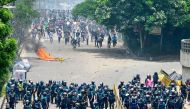 Anti-quota protesters clash with the police in Dhaka on July 18, 2024. (Photo by Munir Uz Zaman / AFP)