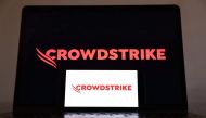 In this photo illustration, the CrowdStrike logo is displayed on a cell phone and computer monitor on July 19, 2024 in Los Angeles, California. (Photo Illustration by Mario Tama/Getty Images) 