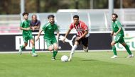 Al Ahli and PSV Eindhoven U-23 players in action.