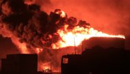 A giant fire erupts at an oil storage facility following Israeli strikes in Yemen's port city of Hodeida on July 20, 2024. (Photo by AFP)
