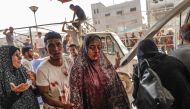 Palestinians rush casualties to Nasser hospital in Khan Yunis following Israeli bombardment east of the city in the southern Gaza Strip on July 22, 2024. (Photo by Bashar Taleb / AFP)