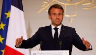 France's President Emmanuel Macron gestures as he delivers a speech during a reception for international journalists accredited for the Paris 2024 Olympic Games at the Elysee Presidential Palace, in Paris on July 22, 2024, ahead of Paris 2024 Olympic and Paralympic games. (Photo by Ludovic MARIN / AFP)

