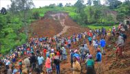 In this grab made from a handout footage released by the Gofa Zone Government Communication Affairs Department on July 22, 2024, shows people standing at the bottom of a landslide that occurred in the Geze-Gofa district. Photo by Gofa Zone Government Communication Affairs Department/ESN / AFP