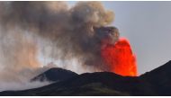 (FILES) This general view shows an eruption of the Mount Etna volcano in Sicily on July 5, 2024. The airport at Catania in Sicily, a top Italian tourist destination has on July 23, 2024, suspended all flights as ash from an eruption at nearby Mount Etna entered the airspace. (Photo by Giuseppe Distefano / Etna Walk / AFP)
