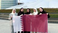 Qatari students taking part in the championship pose for photograph.