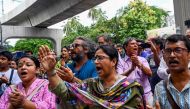 People take part in a song march to protest against the indiscriminate killings and mass arrest in Dhaka on July 26, 2024. (Photo by Munir Uz Zaman / AFP)