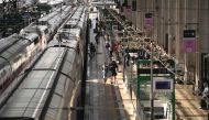 Passengers walk on train platform at the Bordeaux-Saint-Jean train station in Bordeaux, western France on July 26, 2024. (Photo by Christophe Archambault / AFP)