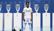 Brazilian forward Endrick Felipe poses during his first appearance as a new Real Madrid player at The Santiago Bernabeu Stadium in Madrid on July 27, 2024. (Photo by JAVIER SORIANO / AFP)
