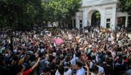 People take part in a protest march outside the High Court building demanding justice for the victims arrested and killed in the recent countrywide violence in Dhaka on July 31, 2024. (Photo by Munir Uz Zaman / AFP)
 