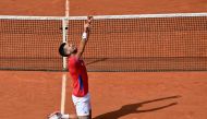 Serbia's Novak Djokovic reacts to beating Spain's Carlos Alcaraz in their men's singles final tennis match on Court Philippe-Chatrier at the Roland-Garros Stadium during the Paris 2024 Olympic Games, in Paris on August 4, 2024. (Photo by Miguel MEDINA / AFP)
