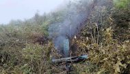 This handout photograph taken on August 7, 2024 and released by the Nepal Army shows the remains of a Air Dynasty chopper that crashed in Nuwakot district on the outskirts of Kathmandu. (Photo by Nepalese Army / AFP)
