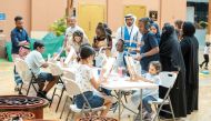 Children with autism and their families during an activity at Blue Circle Club.