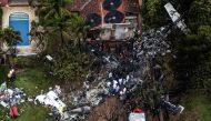 This photo shows an aerial view of the wreckage of an airplane that crashed with 61 people on board in Vinhedo, Sao Paulo State, Brazil, on August 10, 2024. (Photo by Nelson ALMEIDA / AFP)