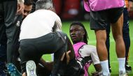 Real Madrid's French midfielder #6 Eduardo Camavinga receives medical treatment during a training session on the eve of the UEFA Super Cup football match between Real Madrid and Atalanta Bergamo, in Warsaw at the National Stadium in Warsaw on August 13, 2024. Photo by Sergei GAPON / AFP