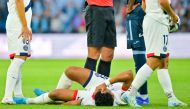 Paris Saint-Germain's Portuguese forward #09 Goncalo Ramos (C) reacts as he lies on the pitch after being injured during the French L1 football match between Le Havre AC and Paris Saint-Germain (PSG) at The Stade Oceane in Le Havre, north-western France on August 16, 2024. (Photo by LOU BENOIST / AFP)
