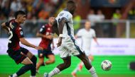 Inter Milan's French forward #09 Marcus Thuram (R) shoots to score his team's second goal during the Italian Serie A football match between Genoa and Inter Milan at the Luigi Ferraris Stadium in Genoa, on August 17, 2024. (Photo by MARCO BERTORELLO / AFP)
