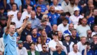 Manchester City's Norwegian striker #09 Erling Haaland celebrates after scoring his team first goal during the English Premier League football match between Chelsea and Manchester City at Stamford Bridge in London on August 18, 2024. (Photo by Adrian DENNIS / AFP)
