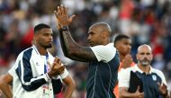 France's coach Thierry Henry acknowledges the fans at the end of the men's gold medal final football match between France and Spain during the Paris 2024 Olympic Games at the Parc des Princes in Paris on August 9, 2024. (Photo by PATRICIA DE MELO MOREIRA / AFP)
