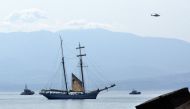 This photograph shows a Coast Guard boat with Italian fireboats and an Italian fire brigade helicopter search for six missing passengers after recovering a victim due to a sailboat sank off the coast of Porticello, nosthwestern of Sicily Island, on August 19, 2024. Photo by Alessandro FUCARINI / AFP.