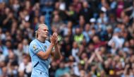 Manchester City's Norwegian striker #09 Erling Haaland applauds fans as he is substituted during the English Premier League football match between Manchester City and Ipswich Town at the Etihad Stadium in Manchester, north west England, on August 24, 2024. (Photo by Darren Staples / AFP) 