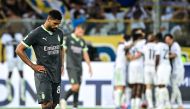 AC Milan's English midfielder #08 Ruben Loftus-Cheek looks dejected as Parma's team celebrates after scoring during the Italian Serie A football match between Parma Calcio 1913 and AC Milan at Ennio-Tardini Stadium in Parma, on August 24, 2024. (Photo by Piero CRUCIATTI / AFP)
