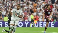Real Madrid's French forward #09 Kylian Mbappe celebrates the opening goal, scored by Real Madrid's Uruguayan midfielder #08 Federico Valverde, during the Spanish league football match between Real Madrid CF and Real Valladolid FC at the Santiago Bernabeu stadium in Madrid on August 25, 2024. (Photo by Pierre-Philippe MARCOU / AFP)
