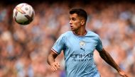 (FILES) Manchester City's Portuguese defender Joao Cancelo controls the ball during the English Premier League football match between Manchester City and Southampton at the Etihad Stadium in Manchester, north west England, on October 8, 2022. (Photo by Oli SCARFF / AFP) 