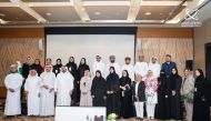 Participants of the forum pose for a group photo. 