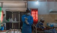 A nurse adjusts his gloves in a mpox ward at the Kavumu hospital, 30 km north of Bukavu in eastern Democratic Republic of Congo, August 24, 2024. Photo by Glody MURHABAZI / AFP.