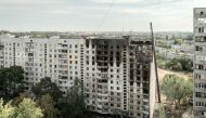 This photograph taken on August 31, 2024 shows a heavily damaged residential building following a recent missile attack in Kharkiv. (Photo by Ivan SAMOILOV / AFP)
