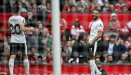 Liverpool's Egyptian striker #11 Mohamed Salah (R) celebrates with Liverpool's Portuguese striker #20 Diogo Jota after scoring the team's third goal during the English Premier League football match between Manchester United and Liverpool at Old Trafford in Manchester, north west England, on September 1, 2024. (Photo by Paul ELLIS / AFP)
