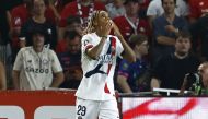 Paris Saint-Germain's French forward #29 Bradley Barcola celebrates after scoring PSG's second goal during the French L1 football match between Lille LOSC and Paris Saint-Germain (PSG) at the Stade Pierre-Mauroy in Villeneuve-d'Ascq, northern France, on September 1, 2024. (Photo by DENIS CHARLET / AFP)
