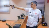(FILES) Silver medalist at the Paris 2024 Olympic Games, Turkish shooter Yusuf Dikec poses for a photograph in Ankara on August 9, 2024. (Photo by Yasin AKGUL / AFP)
