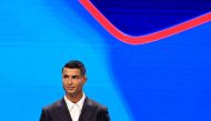 Portugal's national team player and Saudi Al-Nassr's forward Cristiano Ronaldo stands on stage during the ceremony of the draw for the group stage of the 2024-2025 UEFA Champions League football tournament, at the Grimaldi Forum in Monaco on August 29, 2024. Photo by Valery HACHE / AFP.