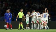 Italy's players celebrate the third goal during the UEFA Nations League Group A2 football match between France and Italy at the Parc des Princes in Paris on September 6, 2024. (Photo by Franck FIFE / AFP)