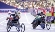 Qatari para athlete Ali Arshad (left) competes in the men's 800 meters wheelchair (T34 category) final at the Paris 2024 Paralympic Games yesterday.