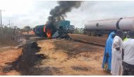This video grab from footage provided by the Niger State Emergency Management Agency (NEMA) shows flames and smoke billowing from a fuel tanker that exploded after colliding with a truck carrying passengers and cattle on a route in Niger state's Agaie local government district on September 8, 2024. Photo by Niger State Emergency Management Agency (NEMA) / AFP