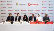 Officials from Vodafone Qatar and Microsoft during agreement signing ceremony.