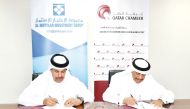 QC Acting General Manager, Ali Bu Sherbak Al Mansouri, and Chairman of Al Ikhtyaar Investment Group, Saad Abdulla Al Tawah Al Hajri, signing the agreement.
