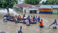 Photo used for demonstration purposes. People affected by floods are escorted through flood water on a military boat in Maiduguri on September 12, 2024. Photo by Audu MARTE / AFP.