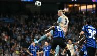 Manchester City's Norwegian striker #09 Erling Haaland (C) has this header saved during the UEFA Champions League, league phase football match between Manchester City and Inter Milan at the Etihad stadium, in Manchester, north-west England, on September 18, 2024 (Photo by Paul Ellis / AFP)