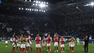 Arsenal's players and Arsenal's Spanish coach Mikel Arteta (R) acknowledge the public at the end of the UEFA Champions League 1st round day 1 football match between Atalanta Bergamo and Arsenal at the Atleti Azzurri d'Italia stadium in Bergamo on September 19, 2024. (Photo by Isabella Bonotto / AFP)