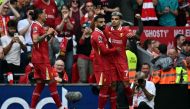 Liverpool's Colombian midfielder #07 Luis Diaz (R) celebrates with teammates after scoring a goal during the English Premier League football match between Liverpool and Bournemouth at Anfield in Liverpool, northwest England, on September 21, 2024. (Photo by Paul ELLIS / AFP)
