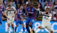Crystal Palace's English midfielder #10 Eberechi Eze (C) runs away from Manchester United's Moroccan defender #03 Noussair Mazraoui (R) during the English Premier League football match between Crystal Palace and Manchester United at Selhurst Park in south London on September 21, 2024. (Photo by Ian Kington / AFP) 