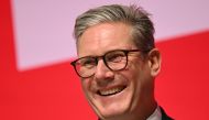 Britain's Prime Minister Keir Starmer smiles on stage on the first full day of the annual Labour Party conference in Liverpool, north-west England, on September 22, 2024. (Photo by Oli SCARFF / AFP)
