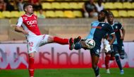 Monaco's Brazilian midfielder #12 Caio Henrique (L) fights for the ball with Le Havre's French forward #23 Josue Casimir (R) during the French L1 football match between AS Monaco and Le Havre AC at the Louis II Stadium (Stade Louis II) in the Principality of Monaco on September 22, 2024. Photo by Christophe SIMON / AFP.